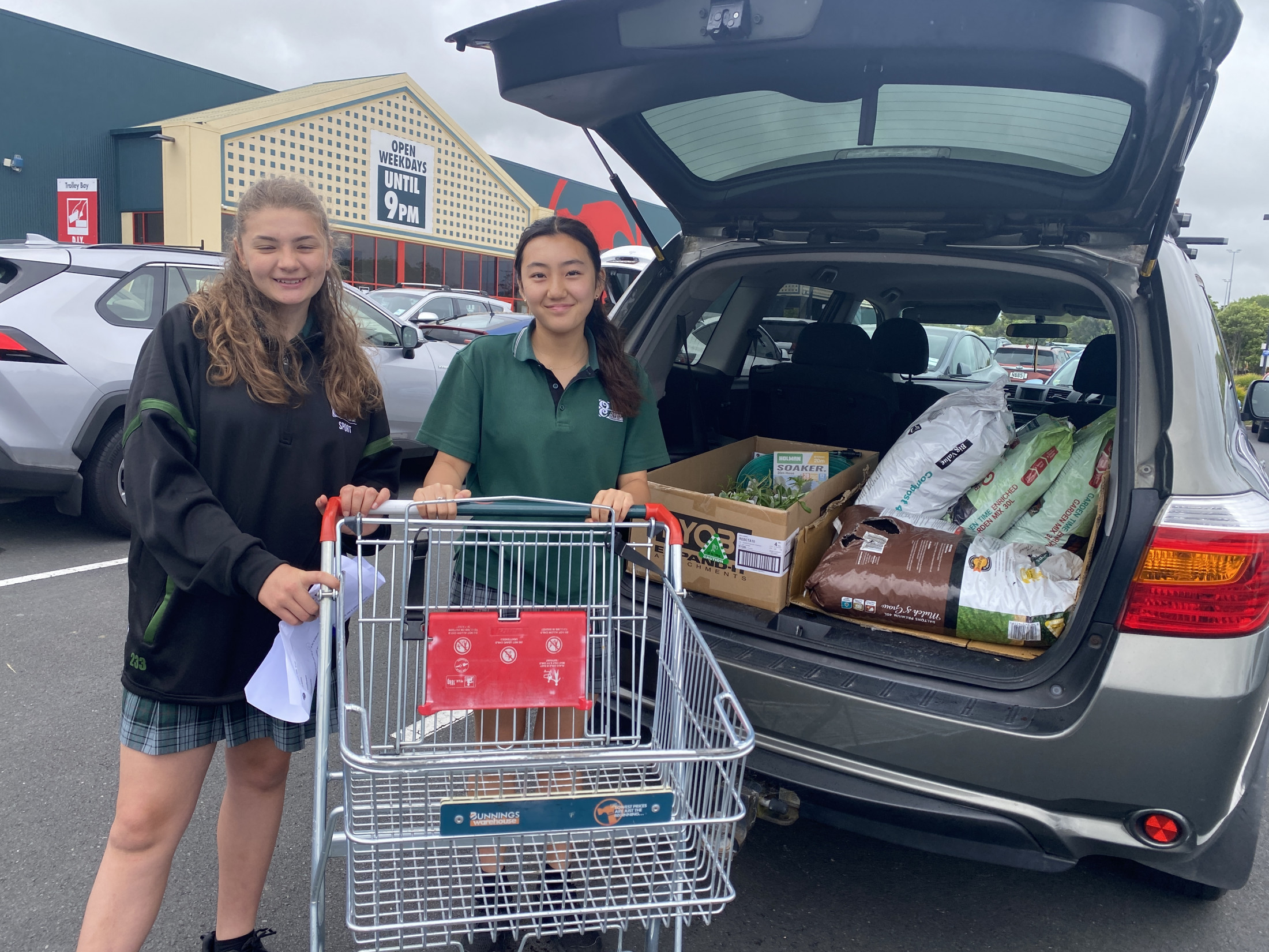 Pippa & Raina Loading The Car With The Bunnings Donations